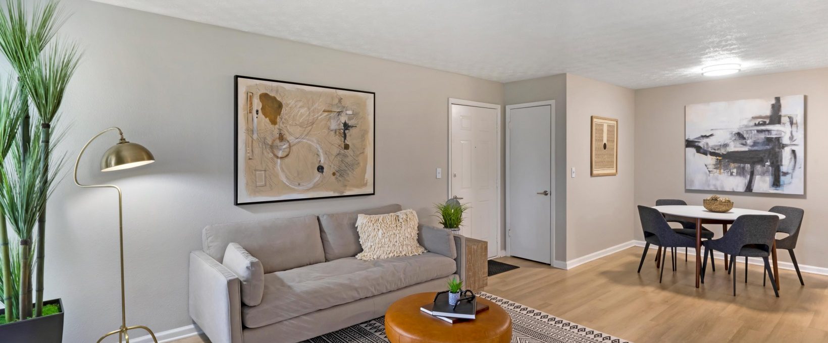 a living room and dining area in a two bedroom apartment at The The Breck
