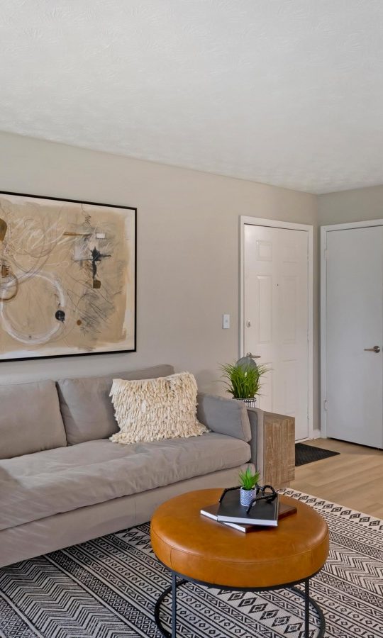 a living room and dining area in a two bedroom apartment at The The Breck