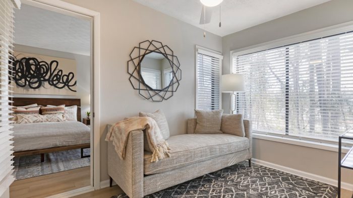 a bedroom with a bed, a mirror and a window at The The Breck