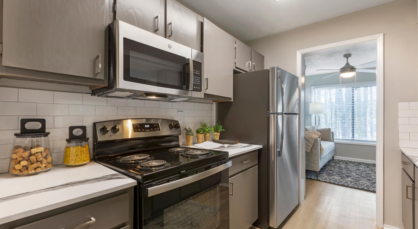 a kitchen with stainless steel appliances and a microwave at The The Breck