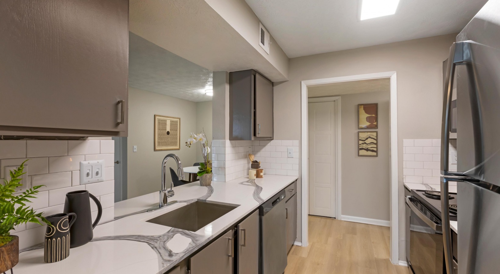 a kitchen with stainless steel appliances and a sink at The The Breck