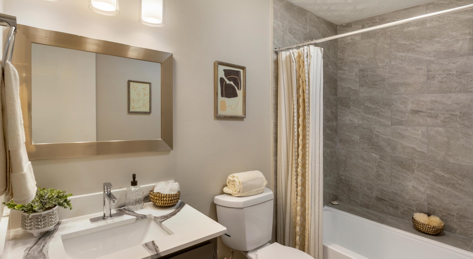 a bathroom with a shower, toilet and sink at The The Breck