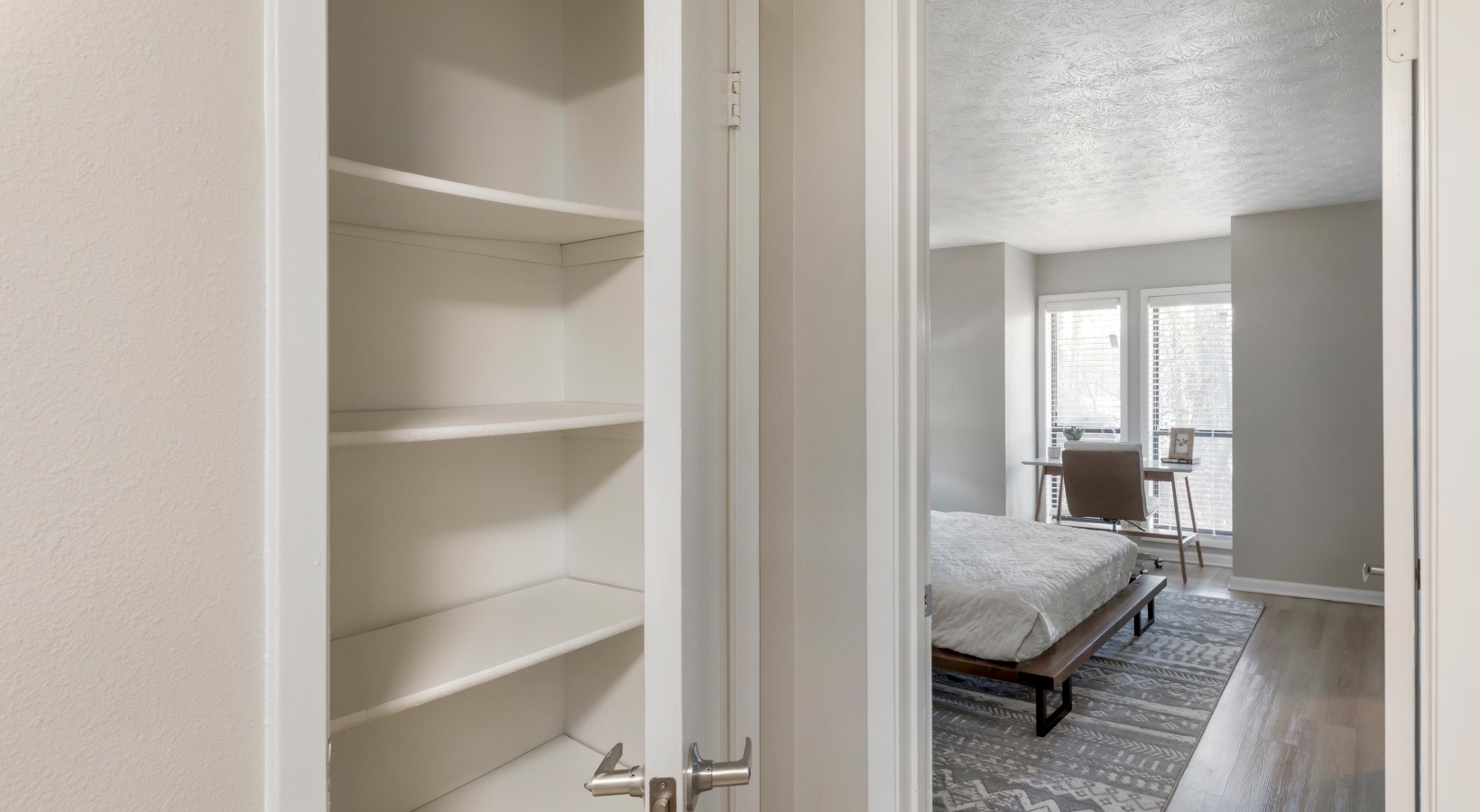 a bedroom with a closet and a bed at The The Breck