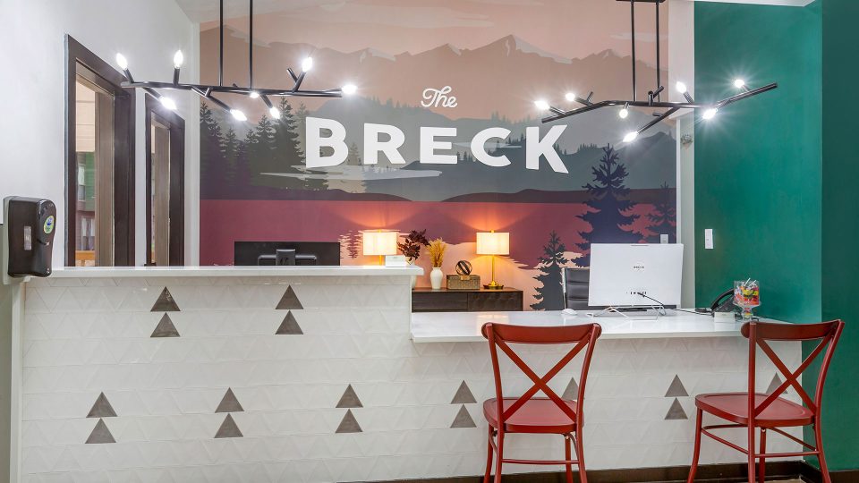 the breckenridge hotel lobby with a sign that says breckenridge at The  Breck