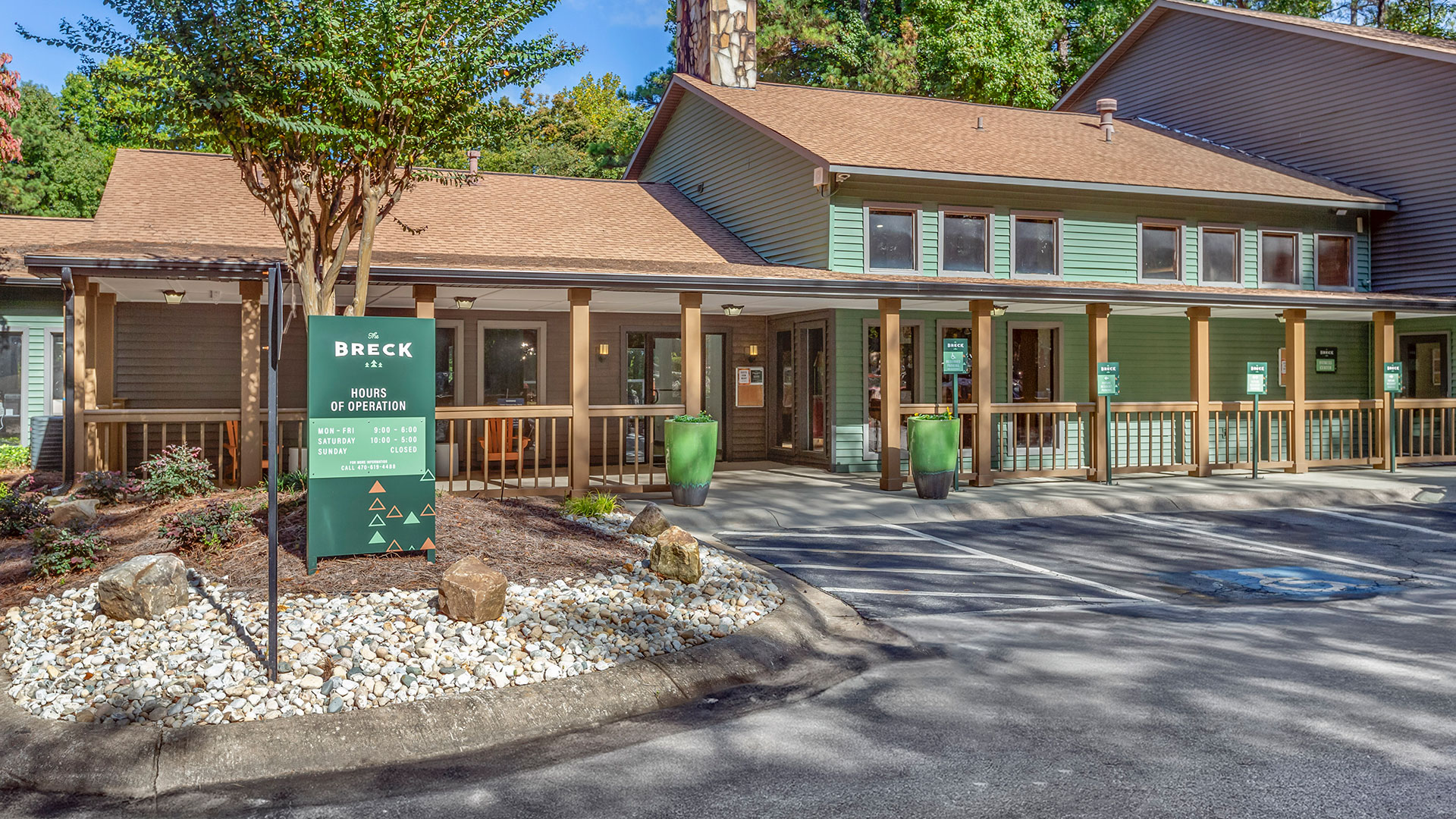 the front entrance to a building with a sign that says, welcome to the lodge at The  Breck
