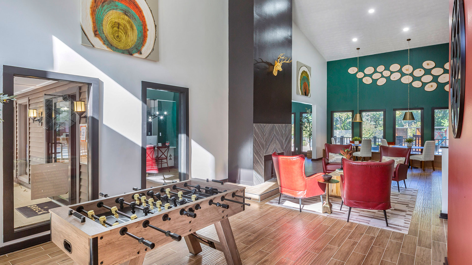 a game room with a foosball table and chairs at The  Breck